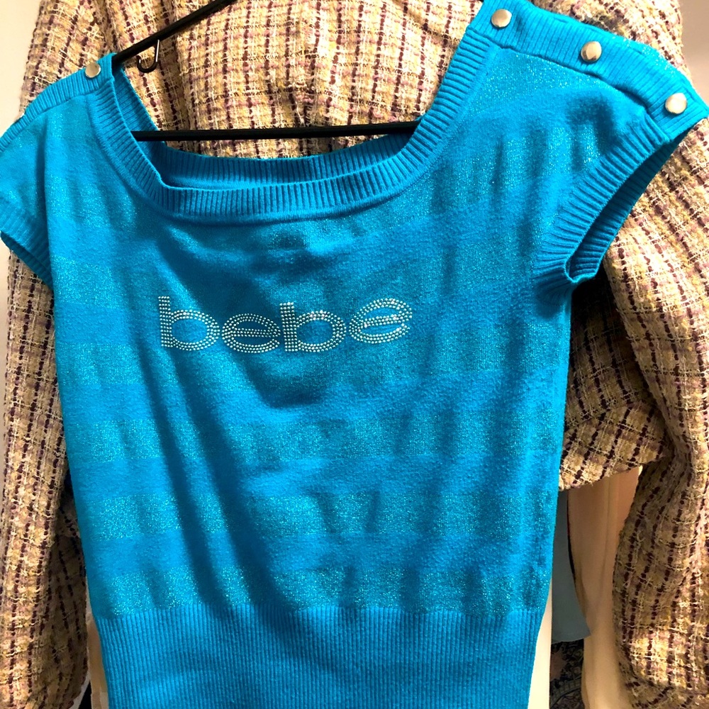 Brand: Bebe size medium, size med top  with teal embroidered BEBE on its